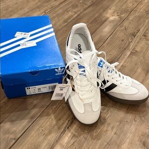 adidas White Low-Top Sneakers with Black Stripes and Blue Tongue Logo